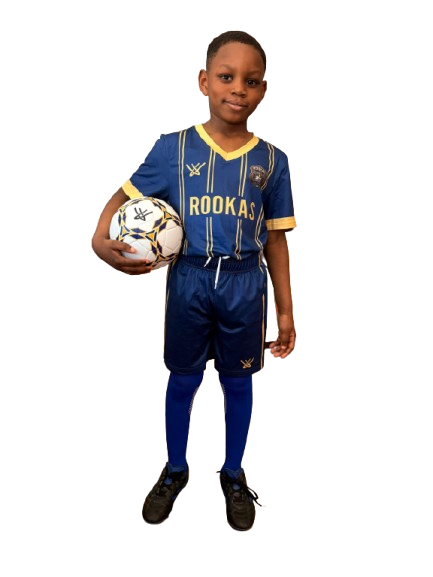 Young ROOKAS player standing confidently in navy and gold kit, ball under arm